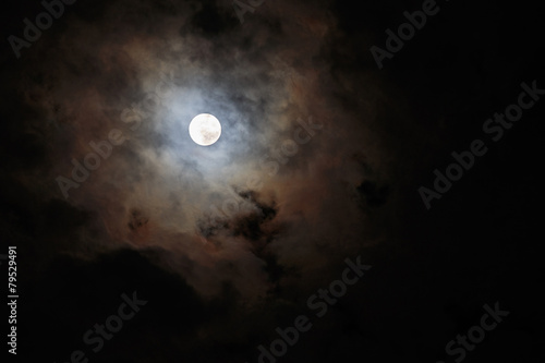 Blurred - dark stormy sky with moon