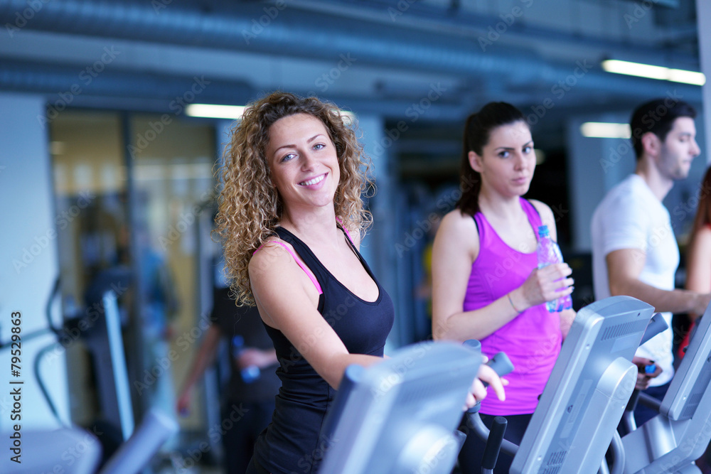 Group of people running on treadmills Group of people running on treadmills