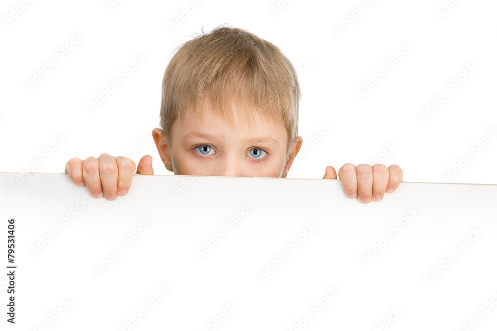 Cute 6 years boy with blue eyes holding a sigh Cute 6 years boy with blue eyes holding a sigh