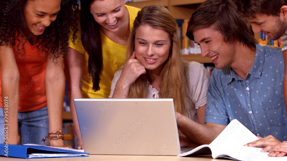 Students working together in the library Students working together in the library