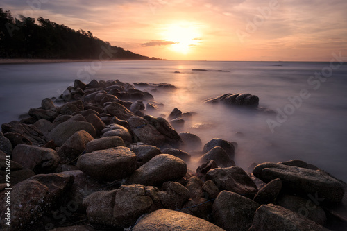 Beautiful sunset at the stone beach © narathip12