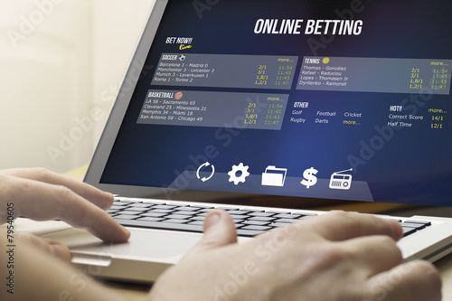 Fototapeta betting online on a laptop