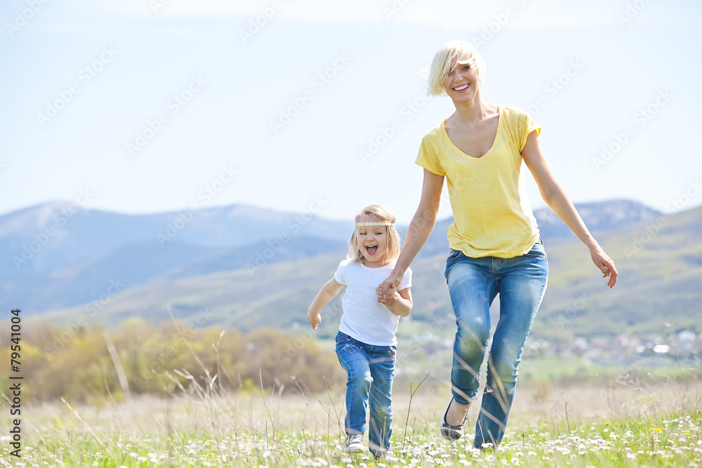 Happy woman with a child resting on the nature