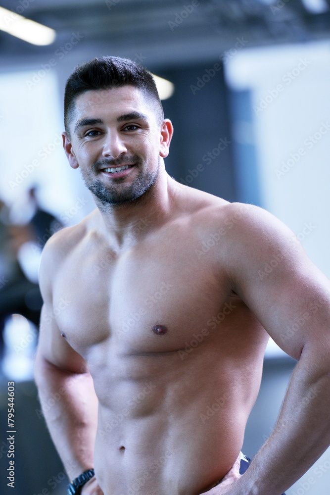 handsome man exercising at the gym handsome man exercising at the gym
