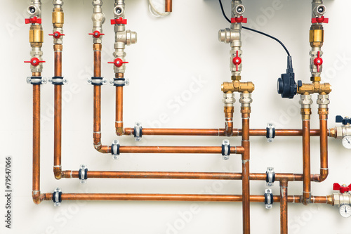 copper pipes in boiler-room photo