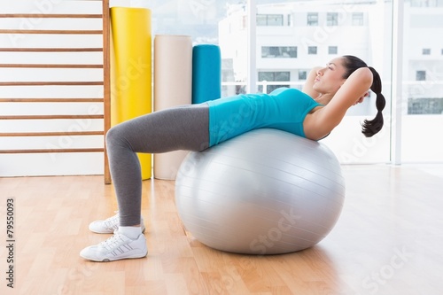 Woman exercising on fitness ball