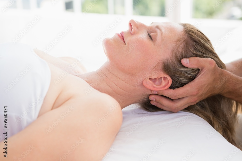 Woman receiving neck massage Woman receiving neck massage