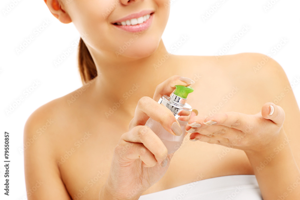 Pretty woman applying balm on hands Pretty woman applying balm on hands