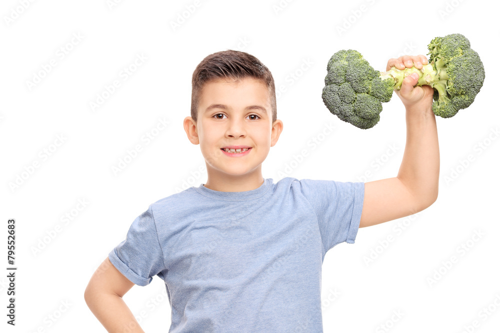 Little boy exercising with a broccoli dumbbell Little boy exercising with a broccoli dumbbell