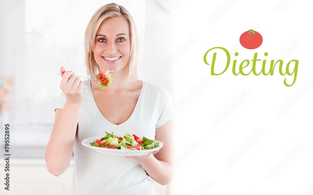 Dieting against close up of a cute woman eating salad Dieting against close up of a cute woman eating salad