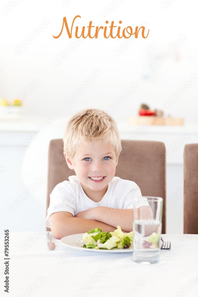 Nutrition against cute little boy ready to eat his salad Nutrition against cute little boy ready to eat his salad