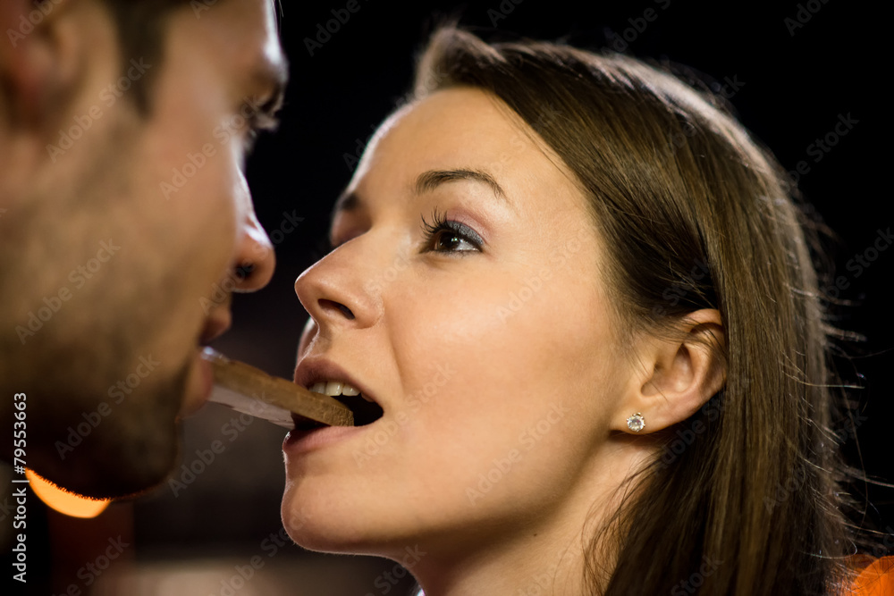 Couple eating chocolate on date Couple eating chocolate on date