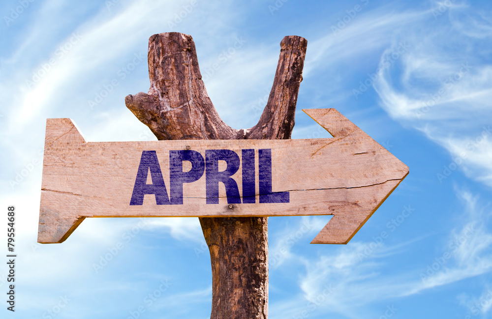 April wooden sign with sky background