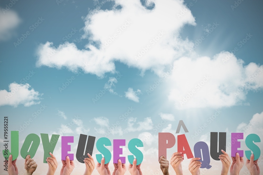 Composite image of hands holding up joyeuses pasques Composite image of hands holding up joyeuses pasques