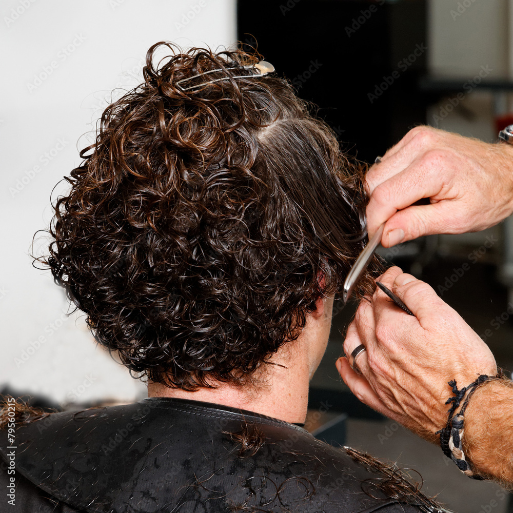 Wunschmotiv: hairdresser cuts the hair close #79560215