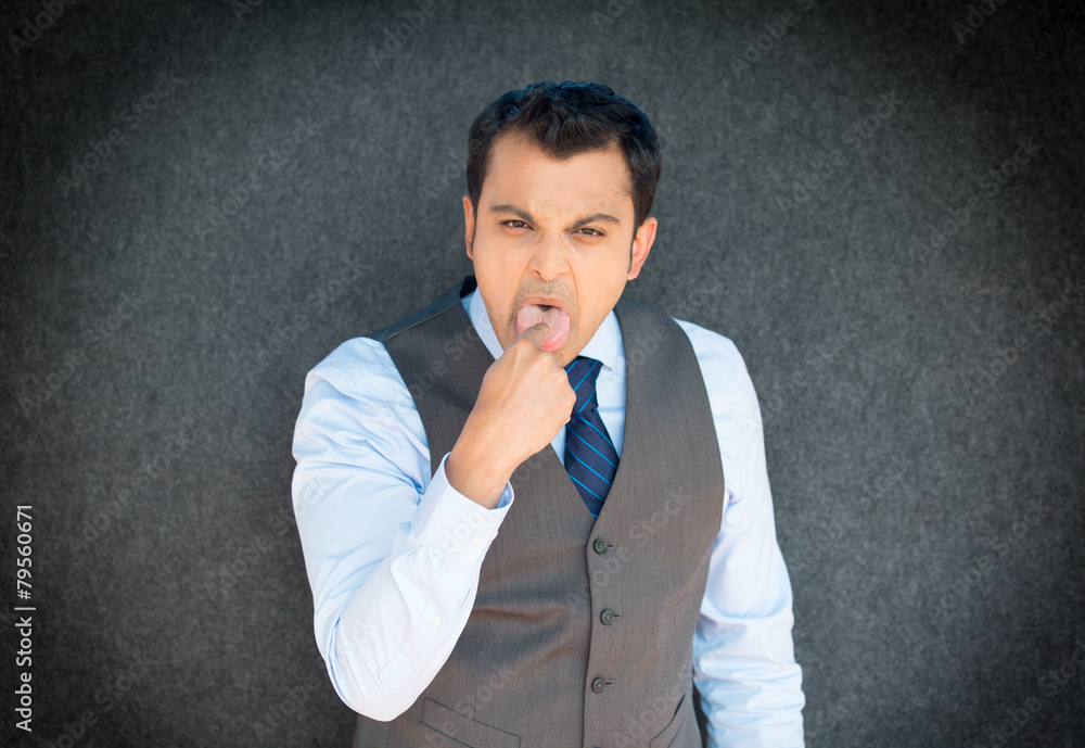 Man sticking finger in mouth Man sticking finger in mouth