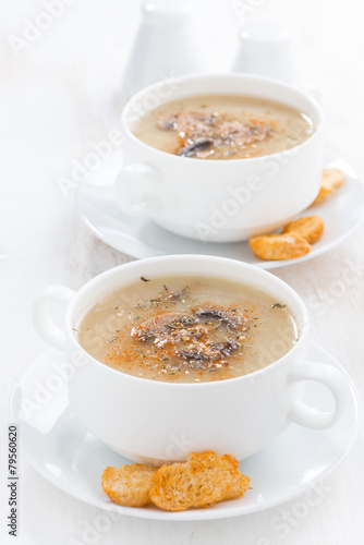 delicious mushroom cream soup with croutons in bowls