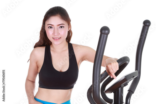 young woman doing exercises with exercise machine