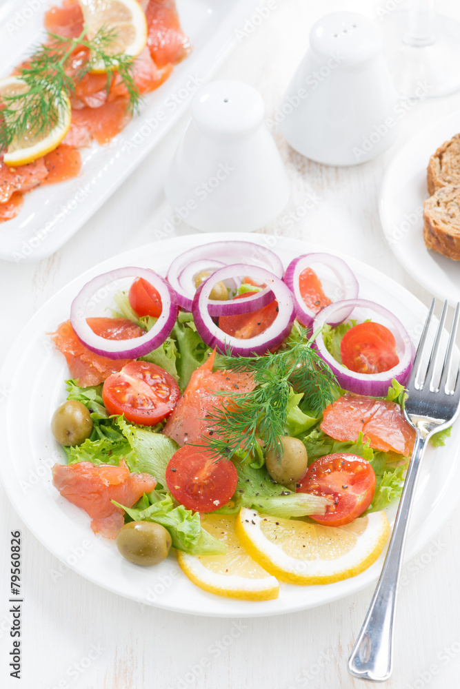 salad with salted salmon, top view, close-up