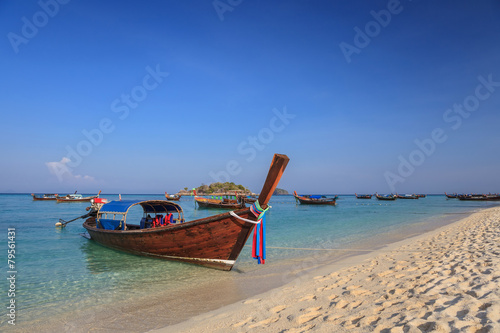 Longtail boat and beautiful ocean of Koh Lipe island, Thailand © Noppasinw