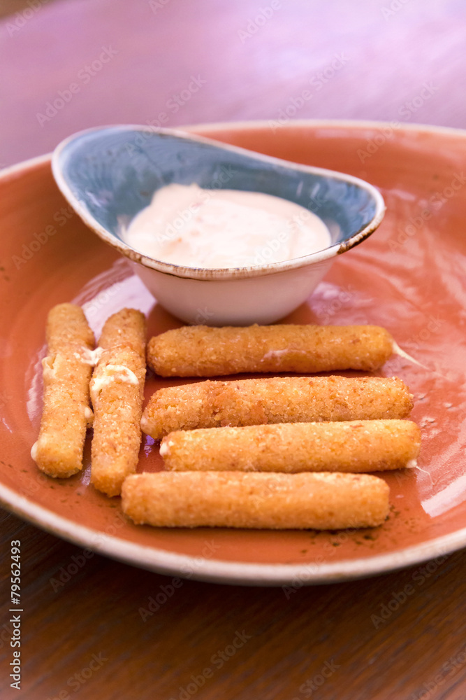 Deep fried breaded cheese sticks with tartar sauce Deep fried breaded cheese sticks with tartar sauce