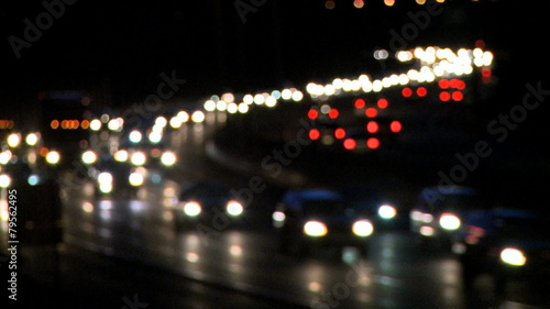 Light rush hour traffci of cars and trucks travel along a major U.S. roadway. photo