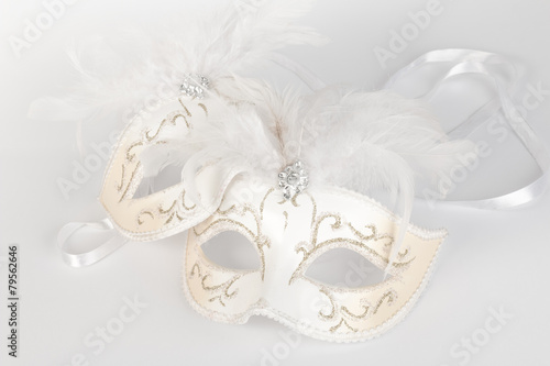Venetian carnival mask in white and gold