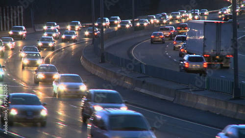 Light rush hour traffci of cars and trucks travel along a major U.S. roadway.