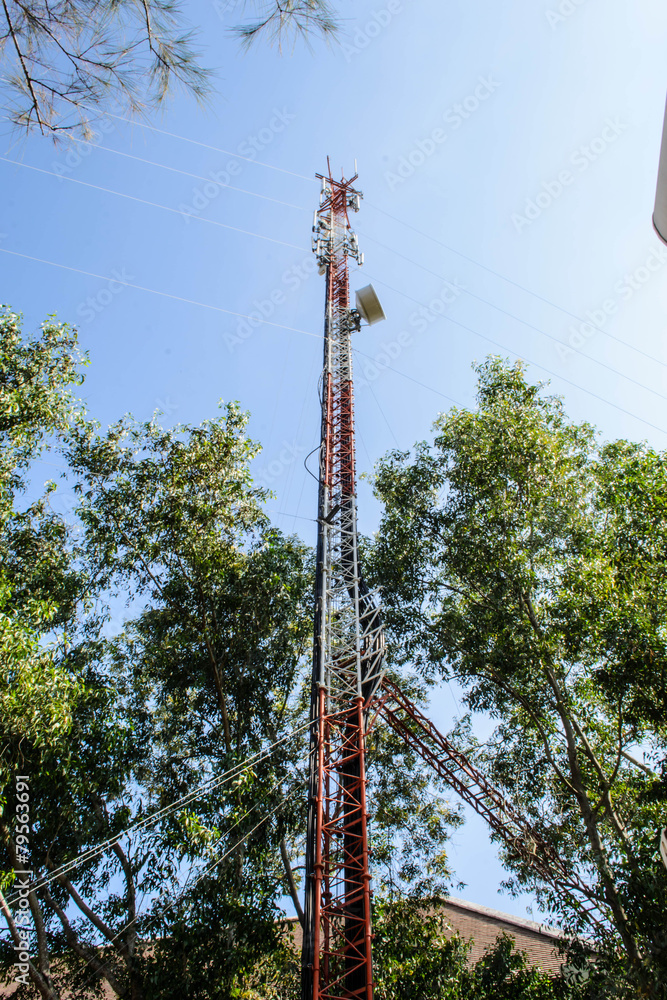 Obraz premium High mast metal structure telecommunication on tower with blue s