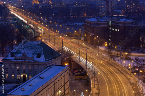 Movement of cars on night street in Warsaw in winter