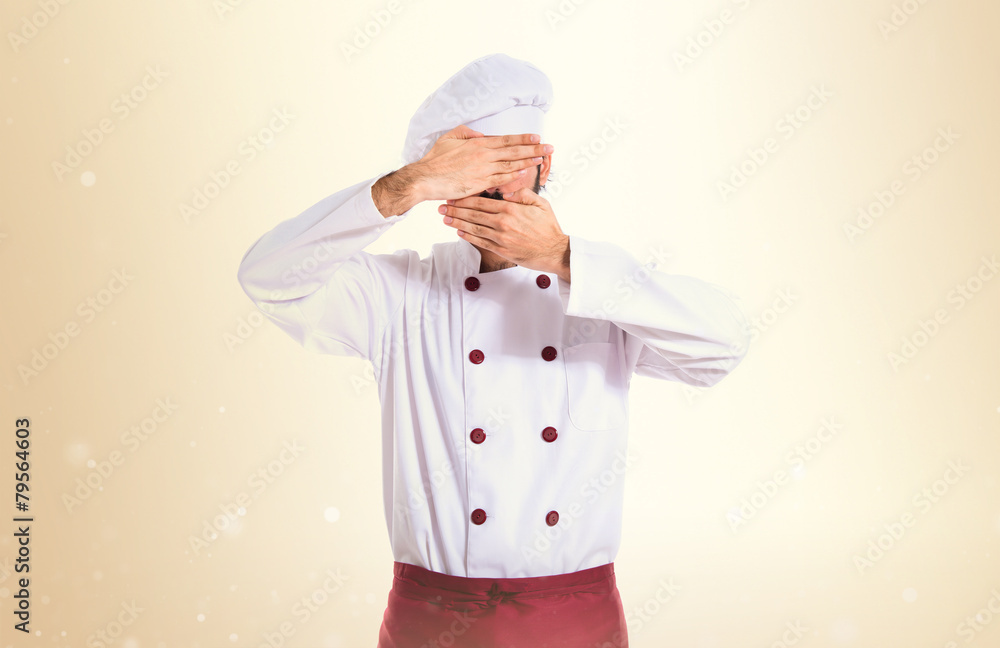Chef covering his face