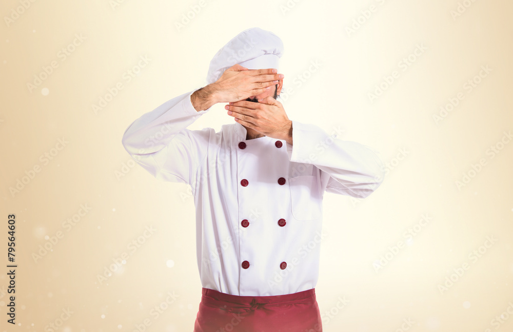 Chef covering his face Chef covering his face