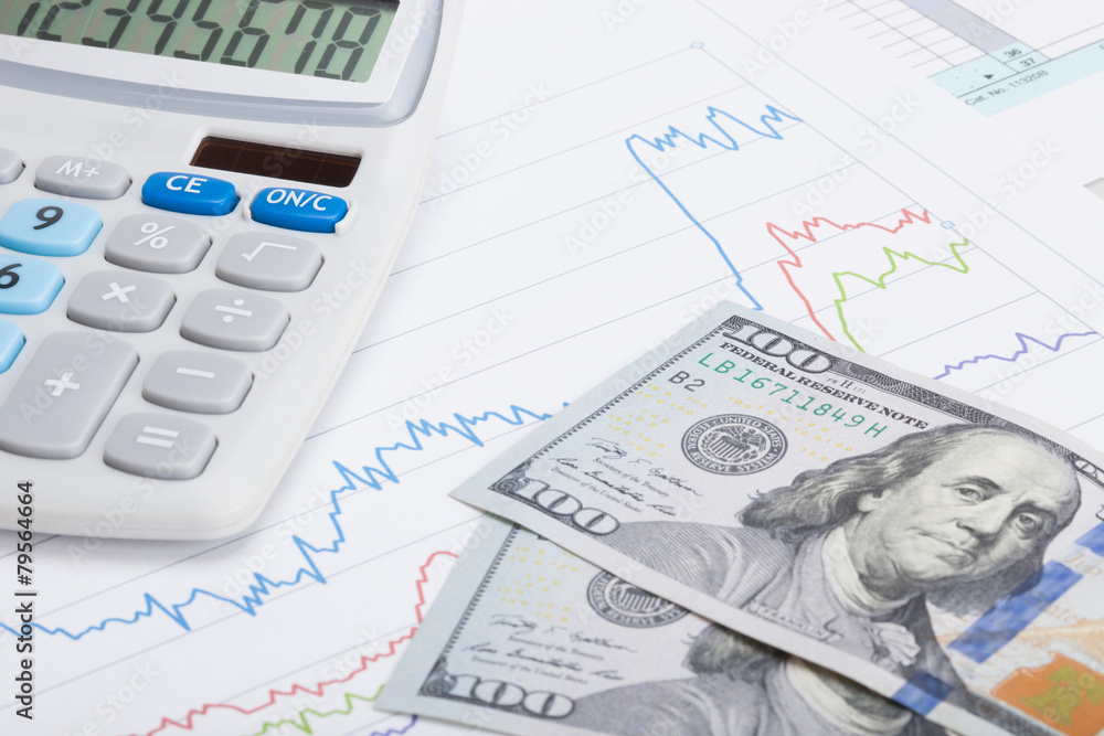 Stock market graph with calculator and 100 dollars banknote Stock market graph with calculator and 100 dollars banknote