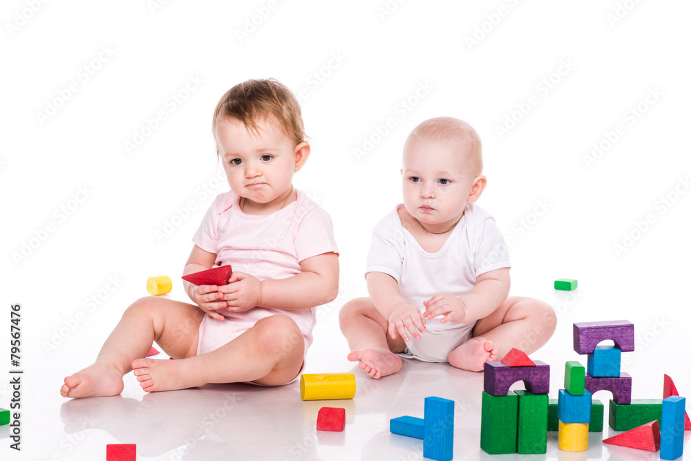 Beautiful babies building with cubes Beautiful babies building with cubes