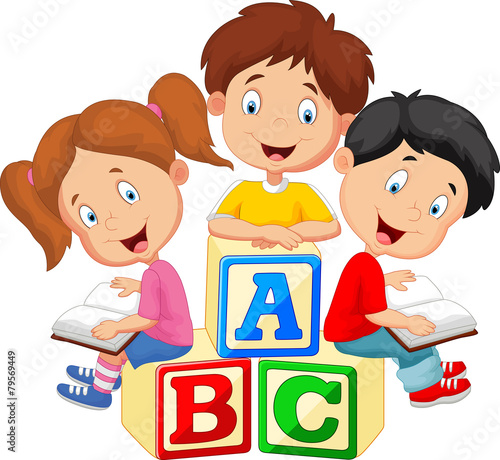 Children reading book and sitting on alphabet blocks