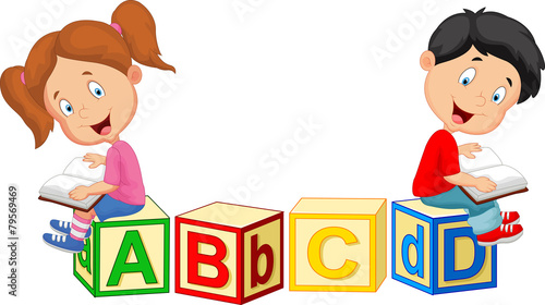 Children reading book and sitting on alphabet blocks #79569469