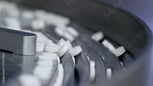 Tablets at a pharmaceutical factory are shot closeup