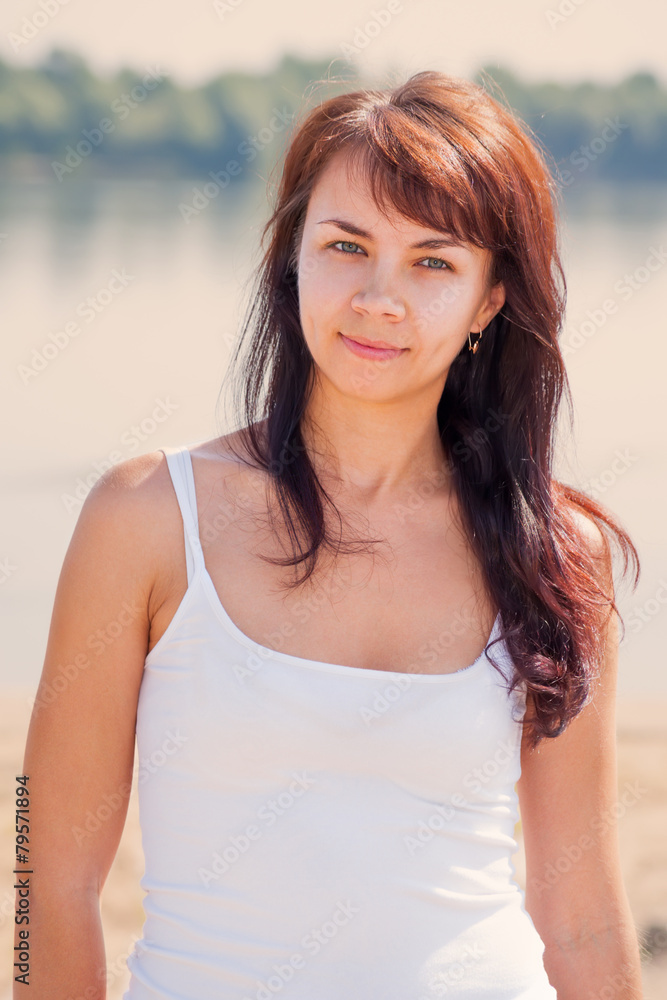 Young pretty woman summer outdoor portrait on the beach