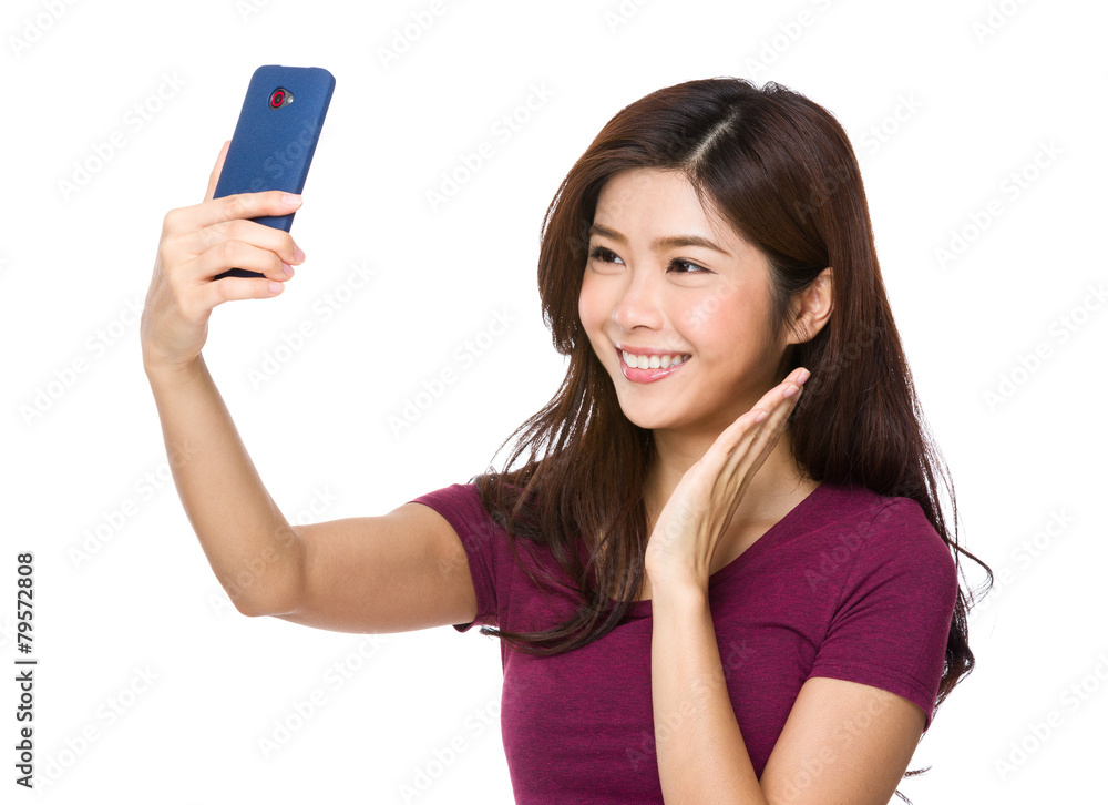 Pretty girl take a self portrait with her smart phone Pretty girl take a self portrait with her smart phone