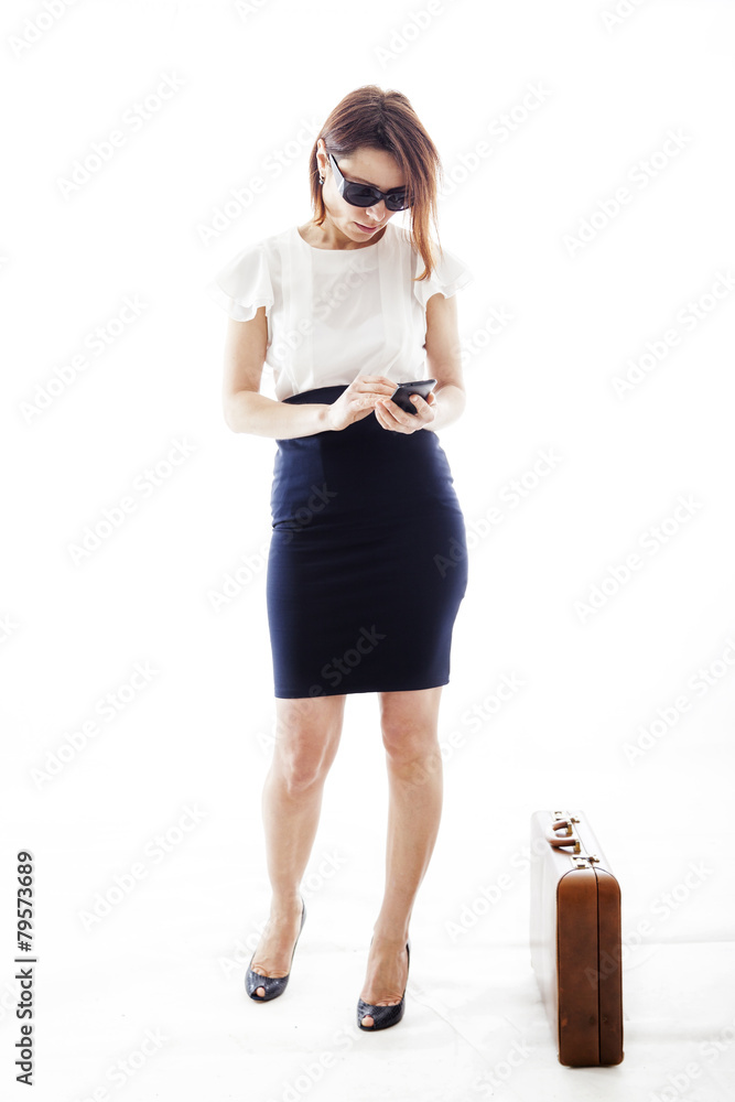 Fototapeta premium businesswoman writes messages to mobile