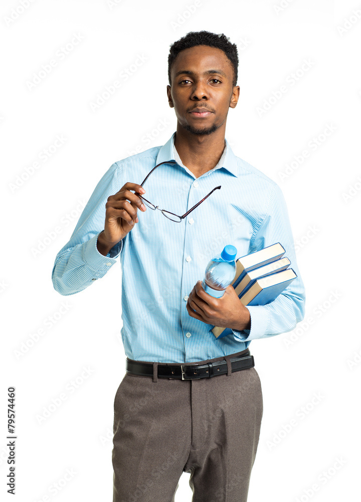 African american college student with books in his hands standin African american college student with books in his hands standin