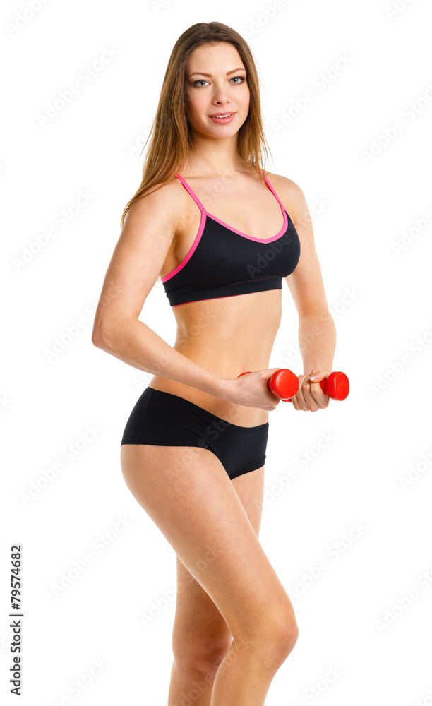 Fototapeta premium Beautiful athletic woman with dumbbells doing sport exercise, is
