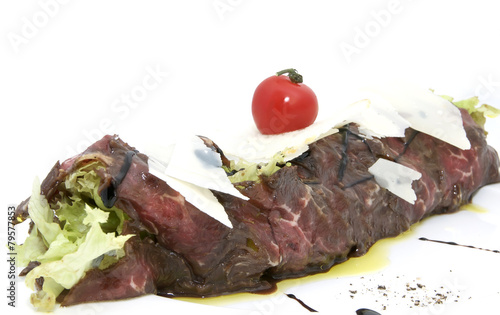carpaccio with herbs and cheese on white background