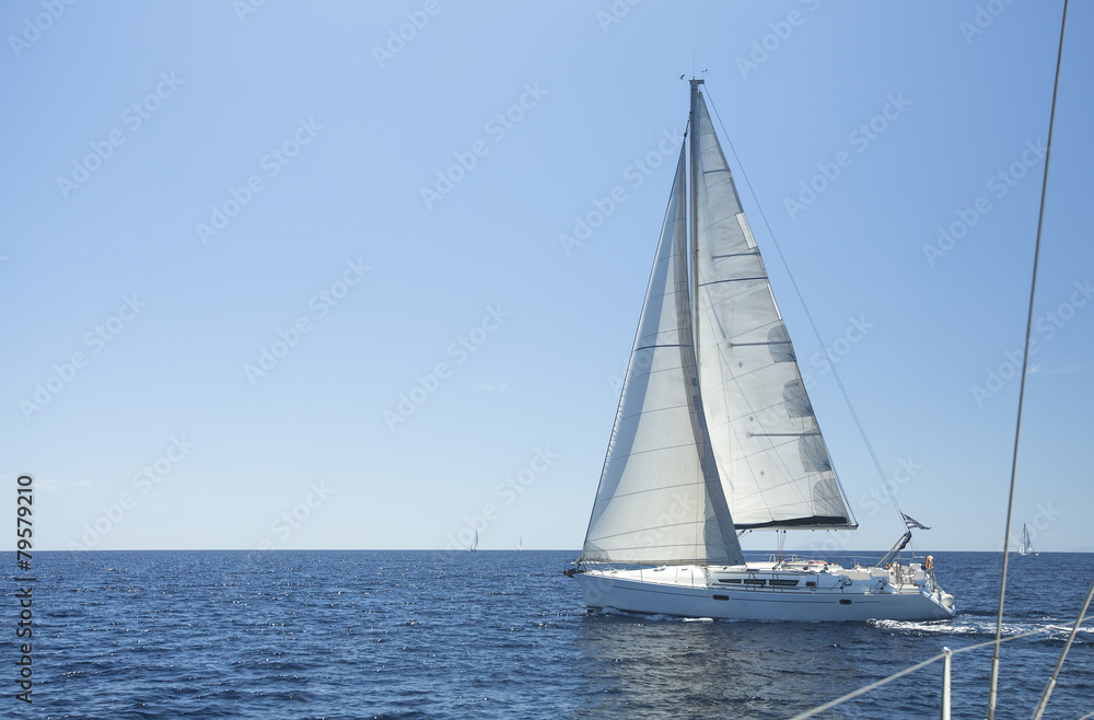 Sailing boat yacht or sail regatta race on blue water. Sailing boat yacht or sail regatta race on blue water.