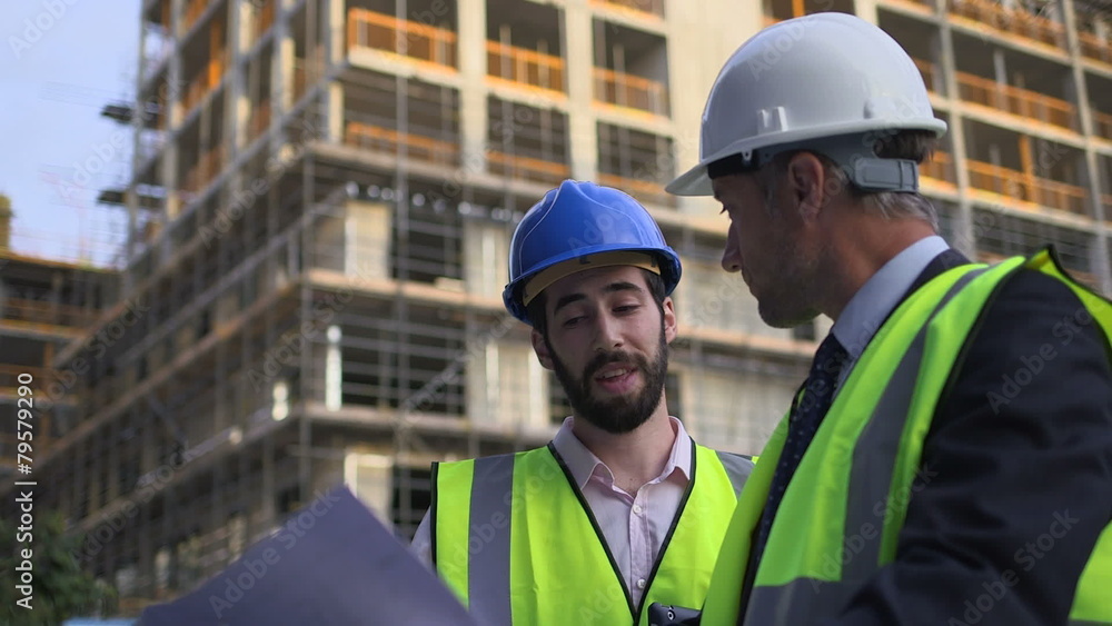 Male architect with blueprint Male architect with blueprint