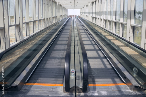 Tape escalator in glazed tunnel © Svetlaya