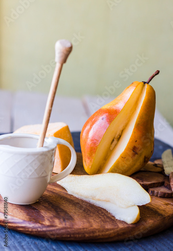 raw juicy pear with cheese and honey