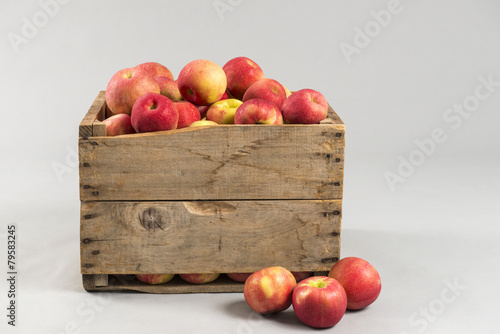 woodern crate full of apples