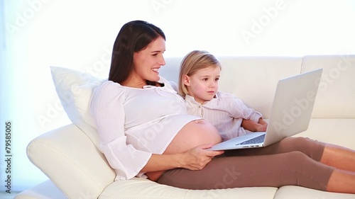 pregnant mother with her daughter