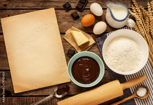 Baking chocolate cake - ingredients and blank paper - background